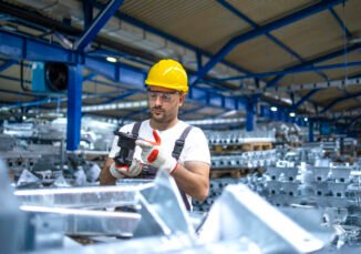 Factory worker working in industrial production hall. factory worker working